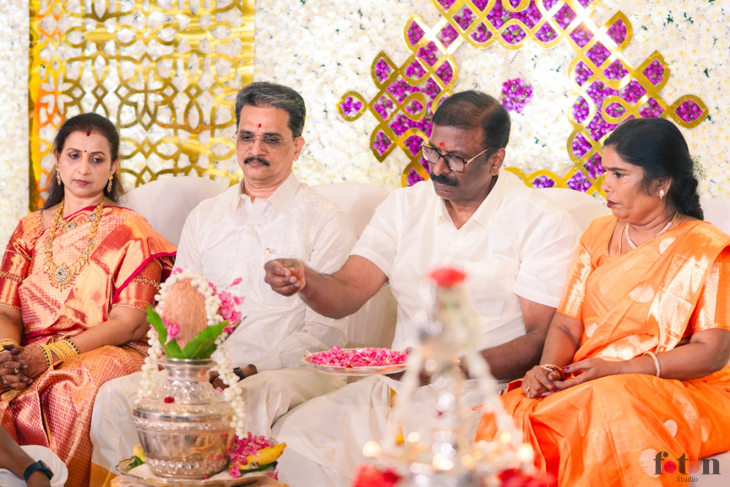 Parents doing the Pooja